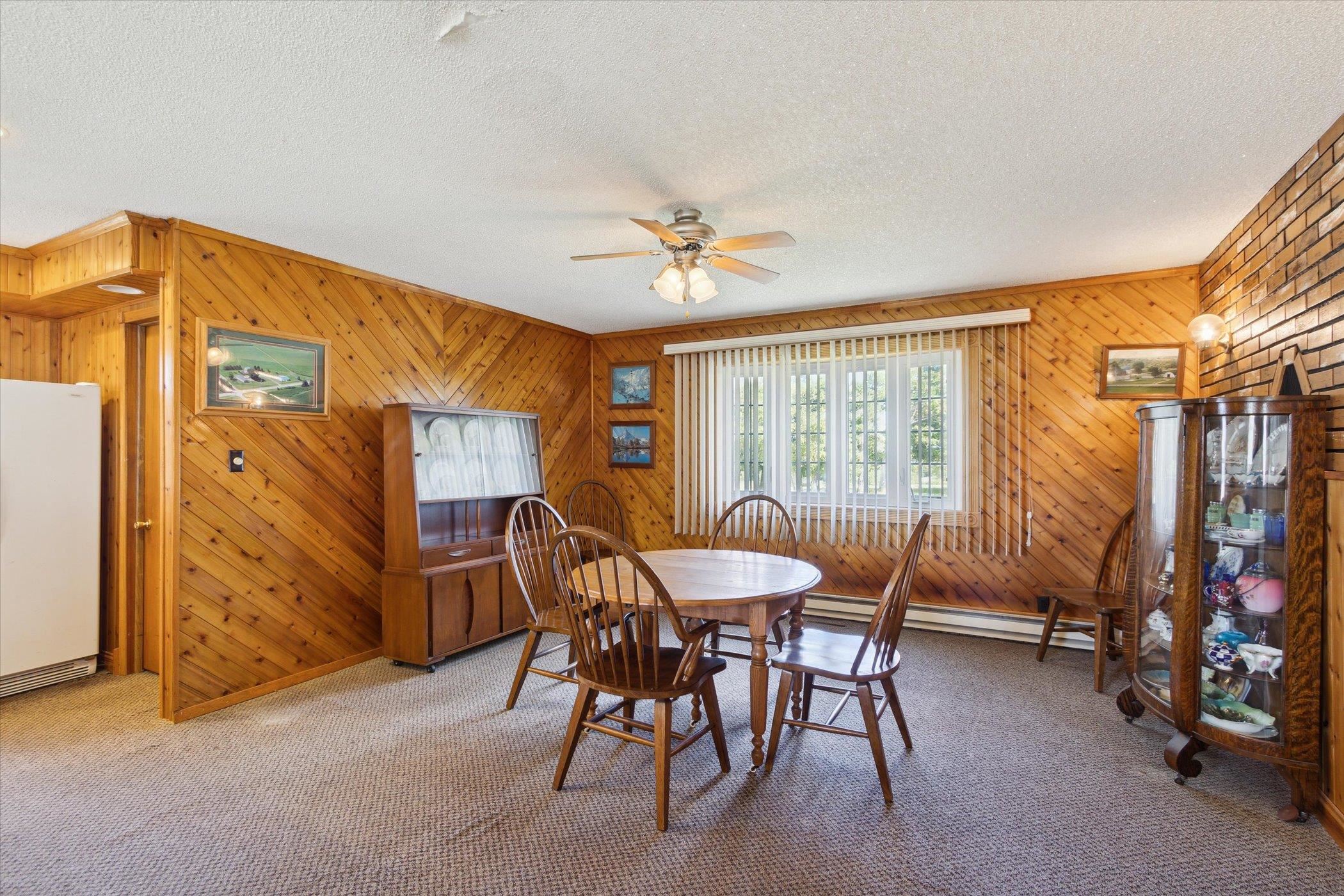 4994 North Unity Road Lena, IL 61048 - Photo 15 of 50 a dining room with furniture and a chandelier