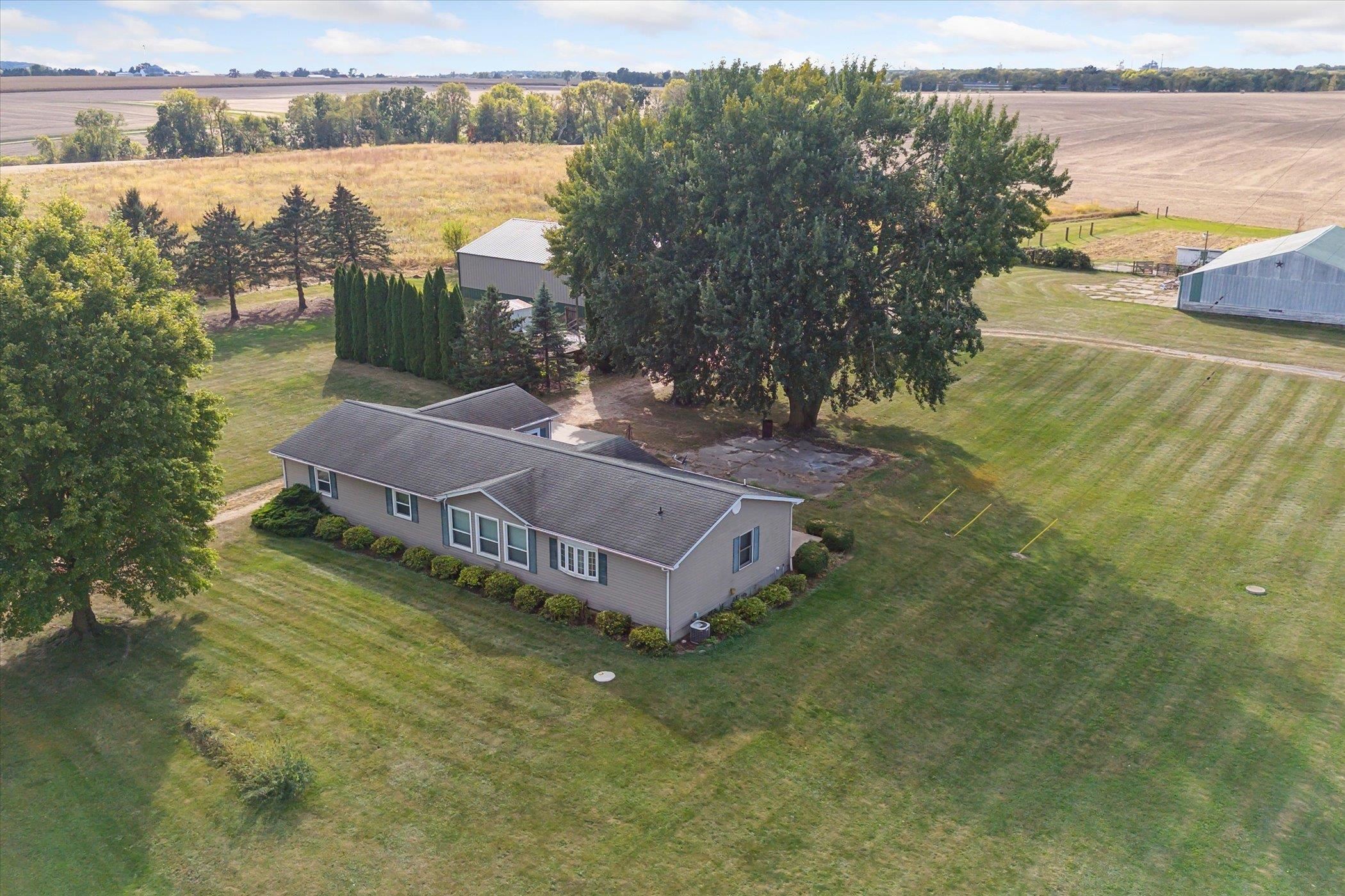 4994 North Unity Road Lena, IL 61048 - Photo 2 of 50 a view of a lake with a house in the background