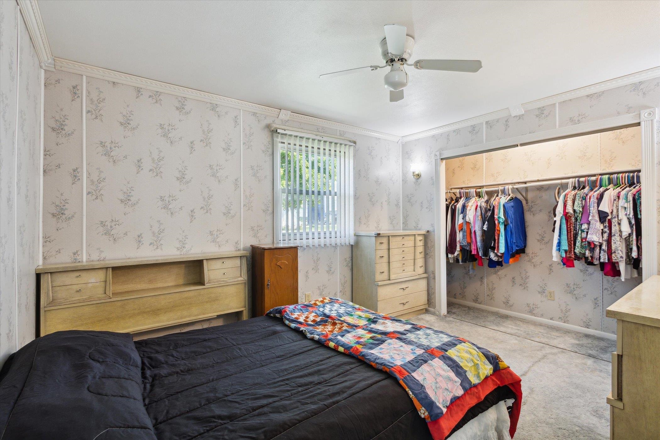 4994 North Unity Road Lena, IL 61048 - Photo 22 of 50 a bedroom with a bed and a walk in closet