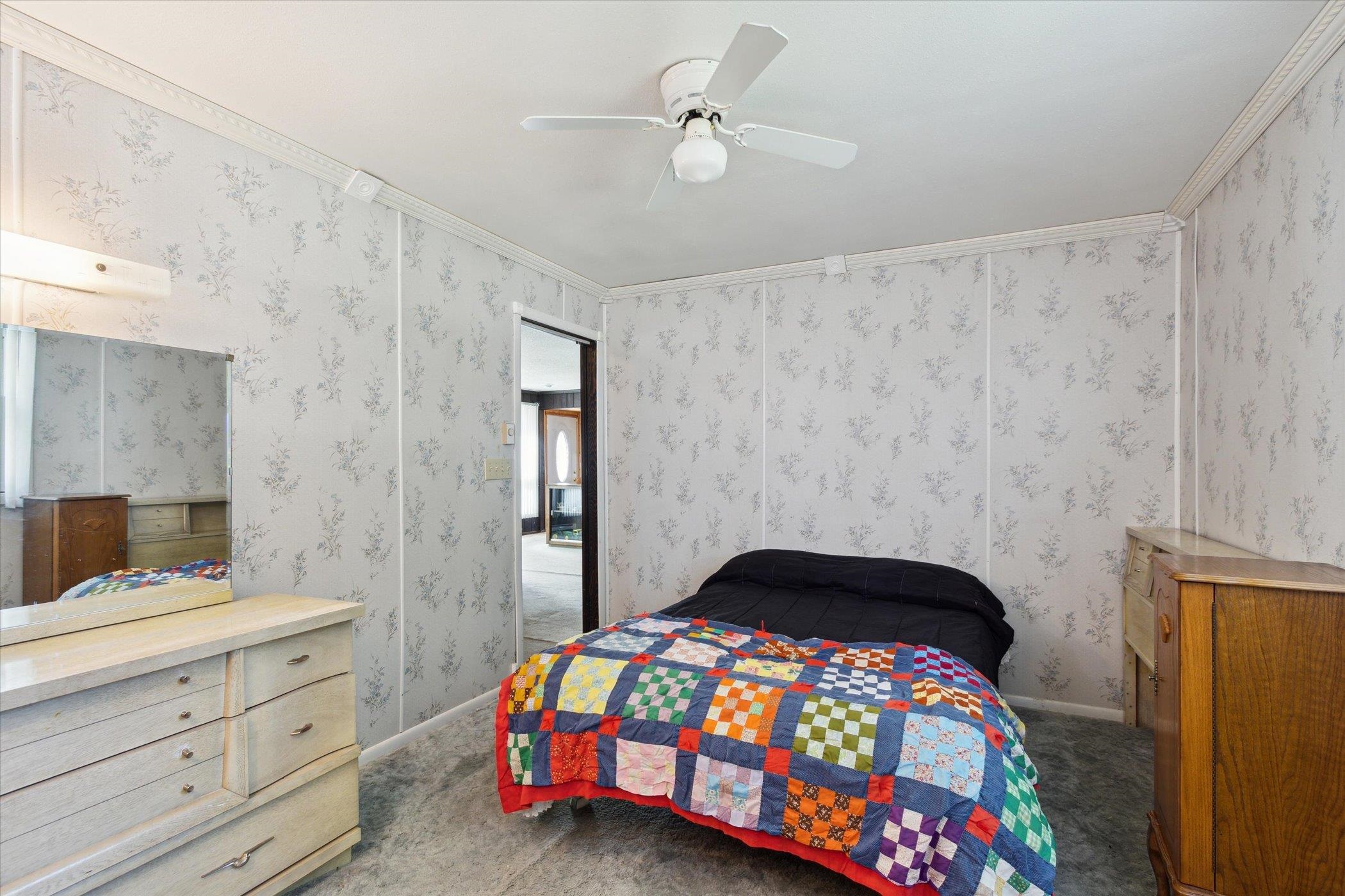 4994 North Unity Road Lena, IL 61048 - Photo 23 of 50 a bedroom with a bed and a dresser in it