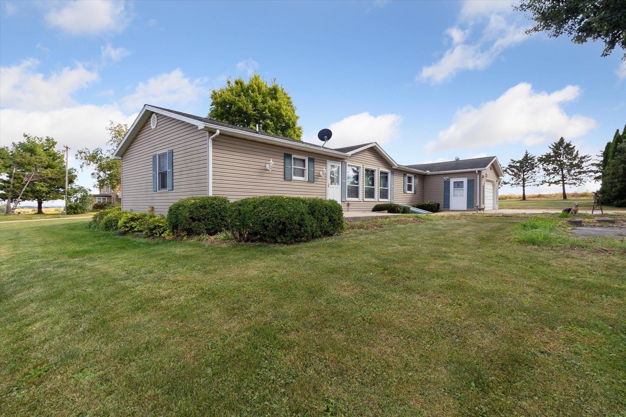 4994 North Unity Road Lena, IL 61048 - Photo 6 of 50 a view of a house with a big yard and large trees