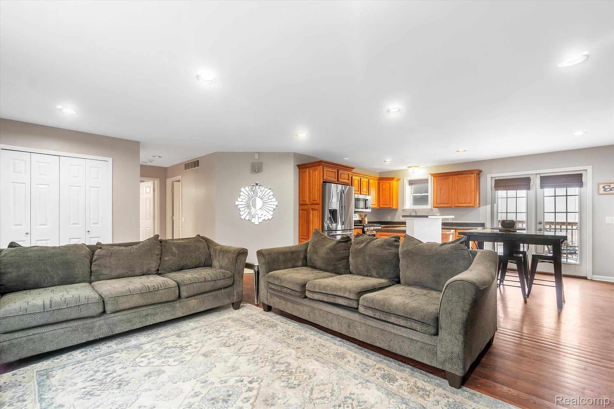 165 Harmon Road Howell, MI 48843 - Photo 5 of 39 Living Room Is Open To Kitchen and Dining, Great For Entertaining
