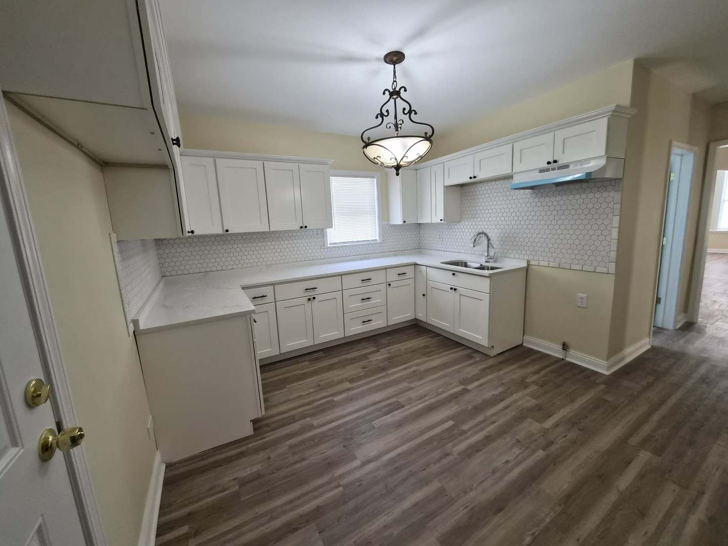 1234 West 72nd Street Chicago, IL 60636 - Photo 6 of 35 a kitchen with cabinets a sink and appliances