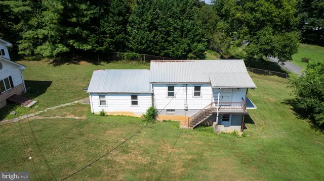 an aerial view of a house with a garden