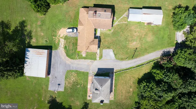 an aerial view of a house with outdoor space