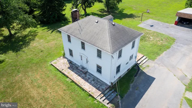 a aerial view of a house with a yard