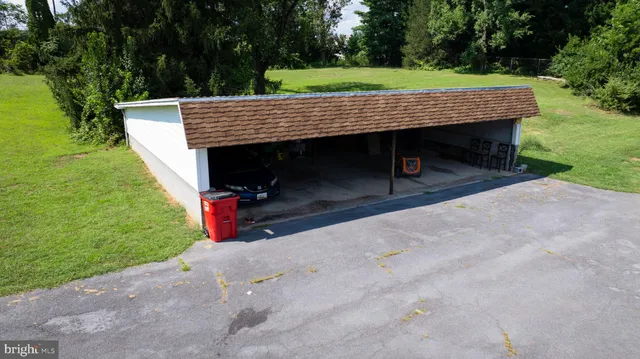 a view of a wooden deck and a yard