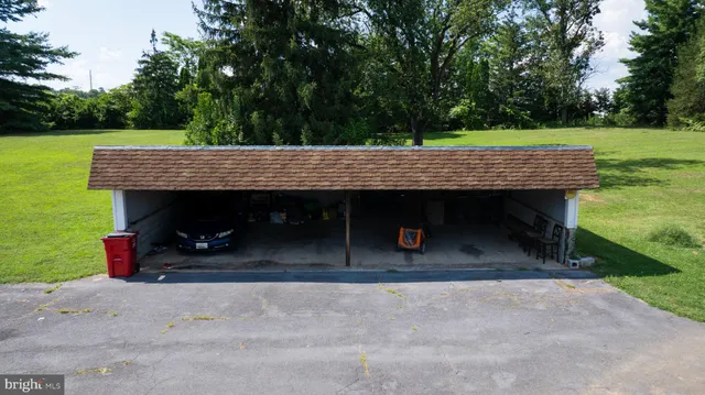 a view of a wooden deck and a backyard