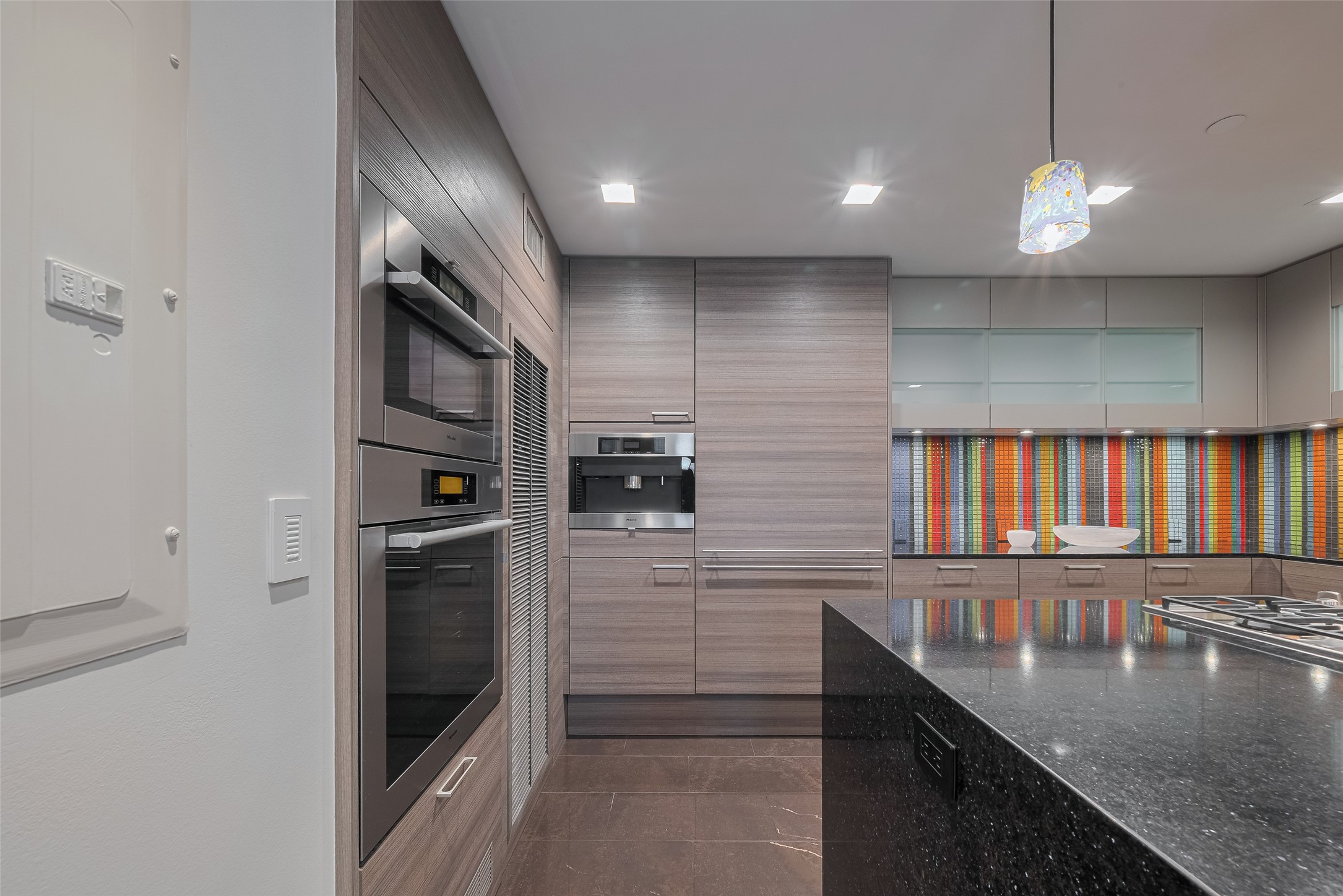 915 Franklin Street, Unit 9N Houston, TX 77002 - Photo 12 of 50 Miele appliances including coffee maker, refrigerator, Oven and warming drawer.