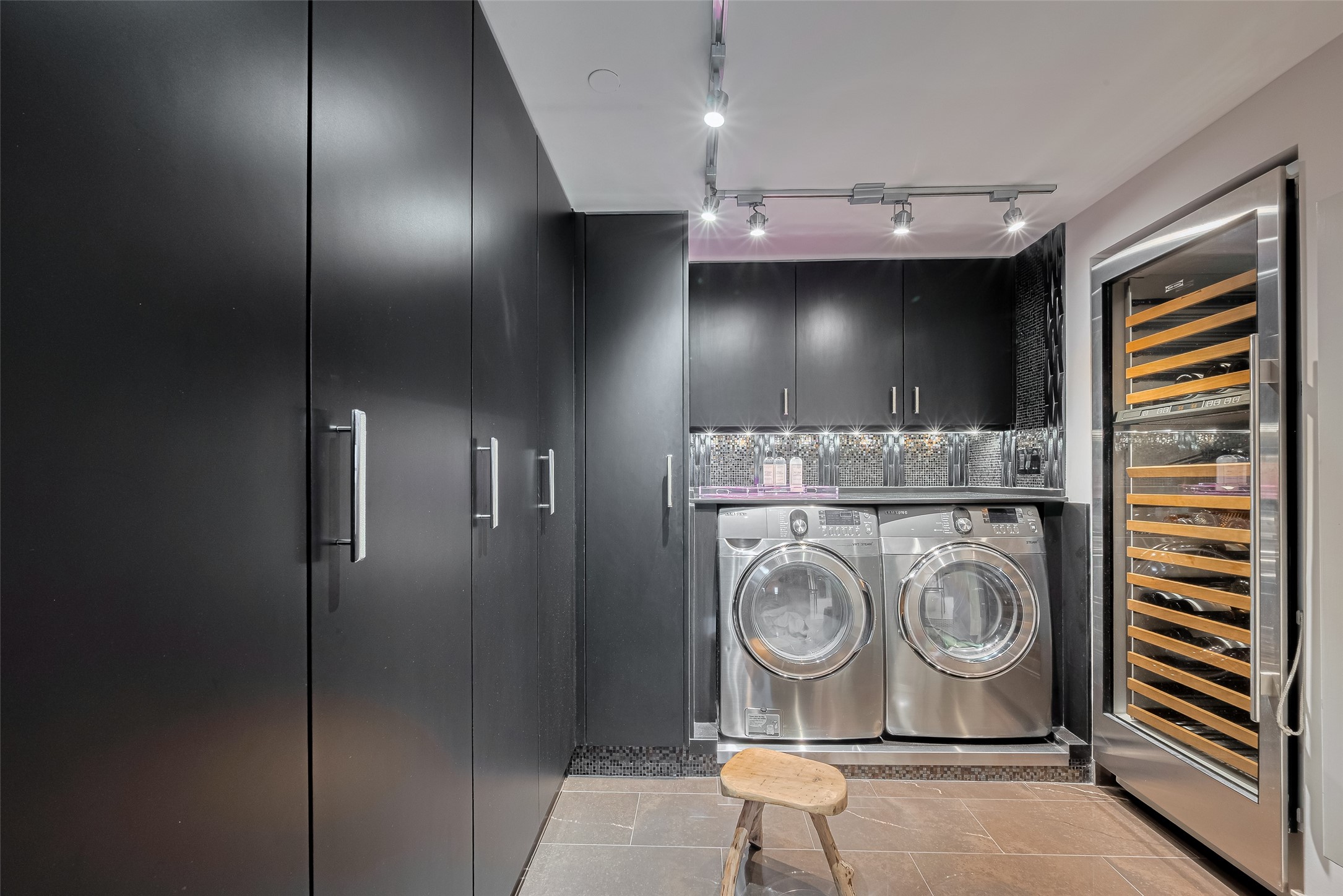 915 Franklin Street, Unit 9N Houston, TX 77002 - Photo 16 of 50 Sub-zero wine fridge in walk-in laundry with walls of storage.