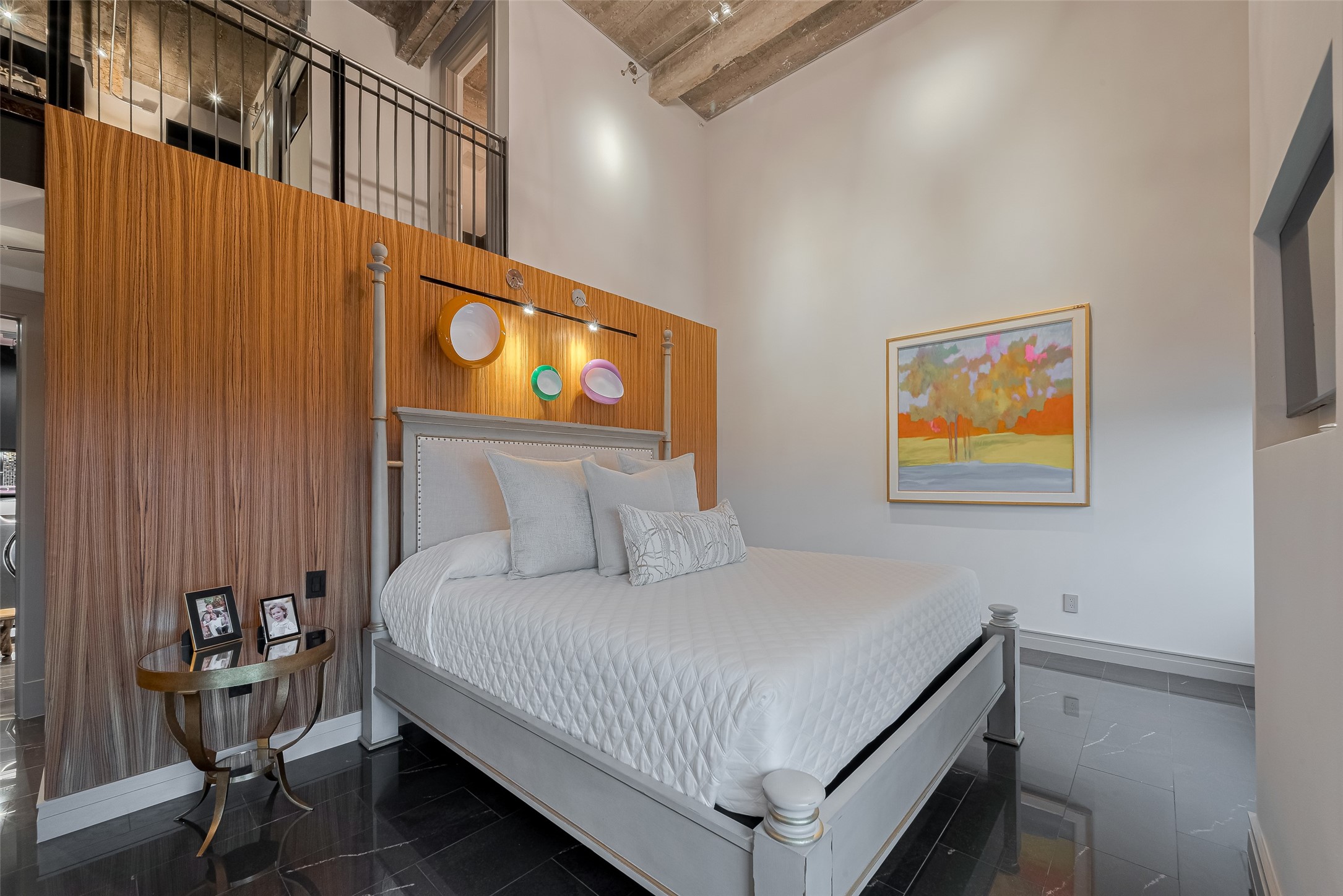 915 Franklin Street, Unit 9N Houston, TX 77002 - Photo 20 of 50 two-story primary bedroom with its own balcony access and stairs up to an office loft
