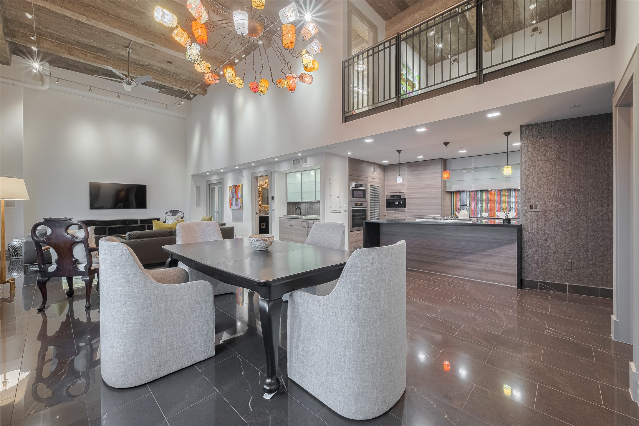 915 Franklin Street, Unit 9N Houston, TX 77002 - Photo 50 of 50 This penthouse unit offers split-level loft upstairs, showcase open-concept floor plans with downtown views, free-standing tubs, and wine fridges—blending industrial chic with luxury