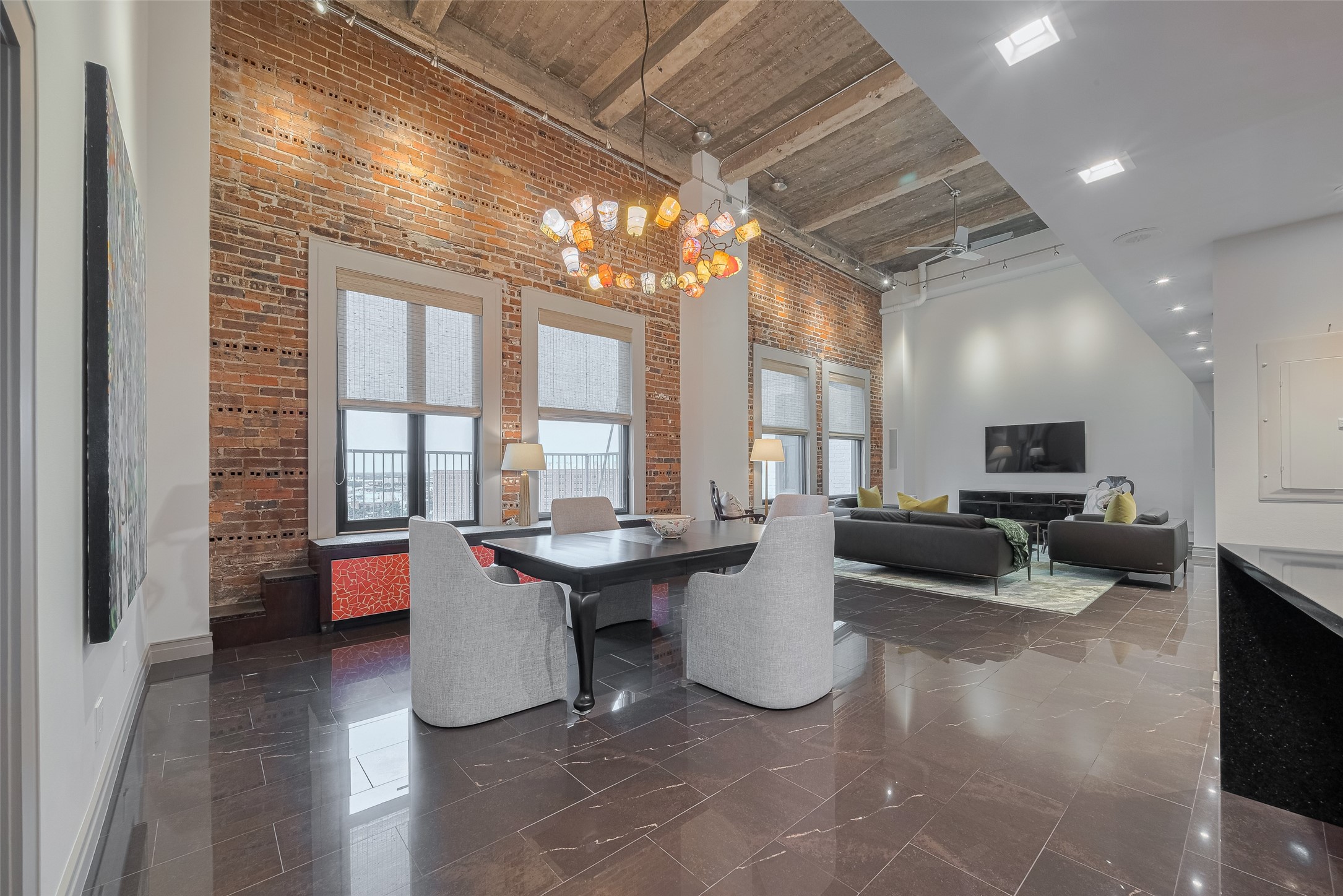 915 Franklin Street, Unit 9N Houston, TX 77002 - Photo 3 of 50 Residents enjoy 24/7 concierge and security, reserved garage parking, a fitness center, and rooftop terrace with private pool.