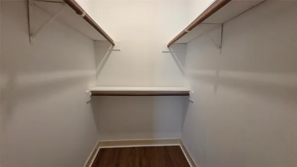 a view of staircase with white walls