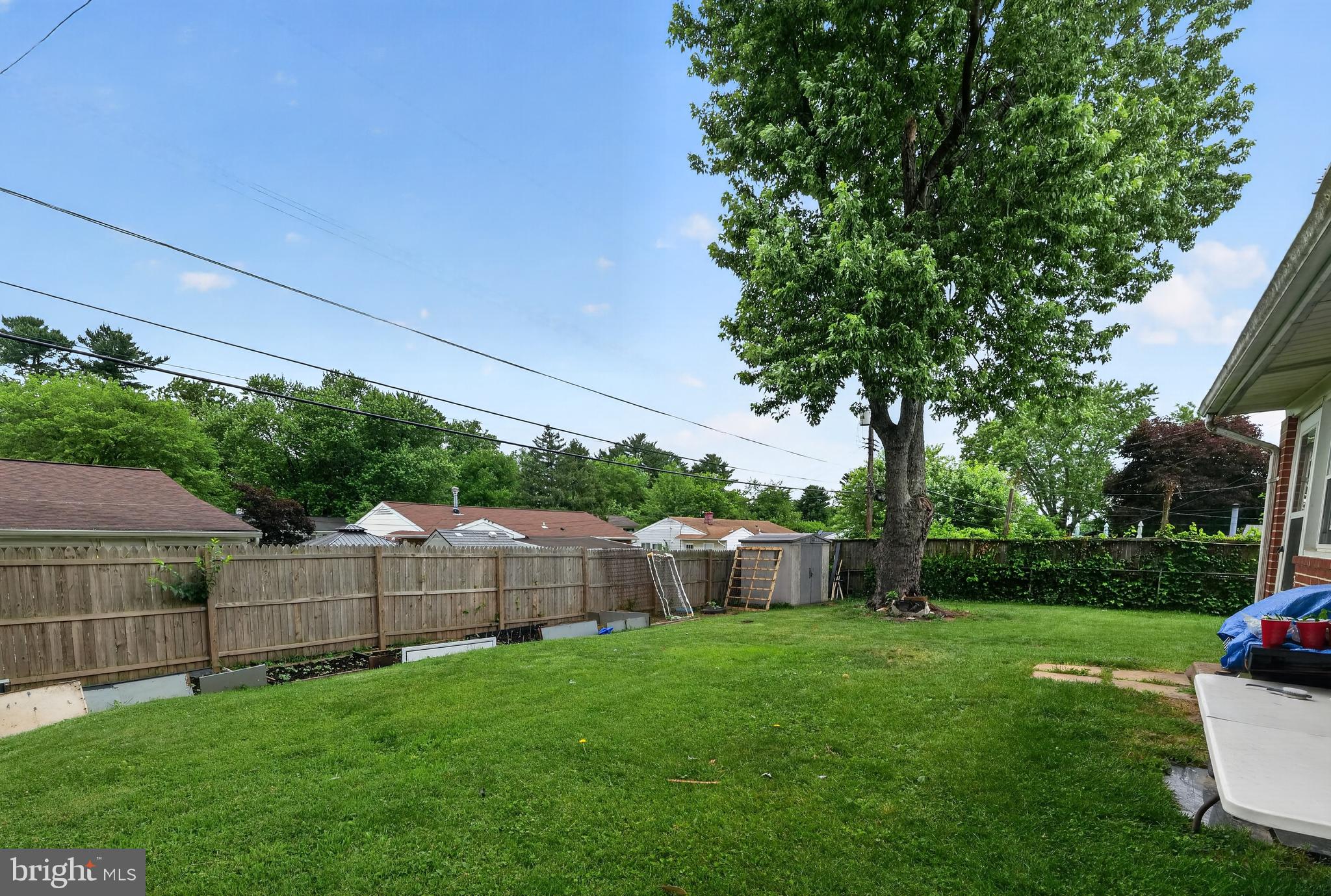 5909 Charnwood Road Catonsville, MD 21228 - Photo 31 of 31 Spacious backyard with lush greenery.