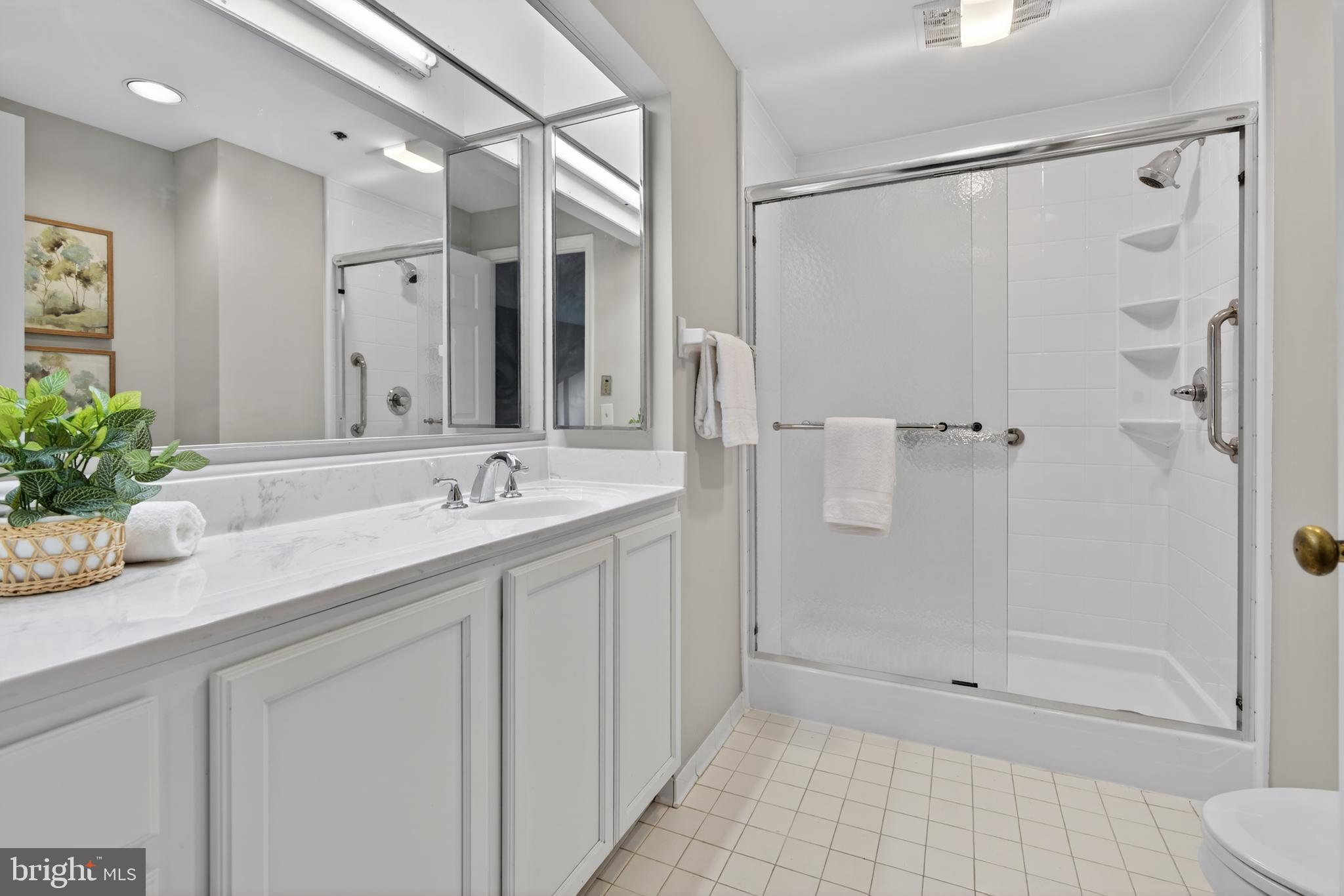 2 Southerly Court, Unit 101 Baltimore, MD 21286 - Photo 11 of 27 Updated bath w walk-in shower attached to bedroom