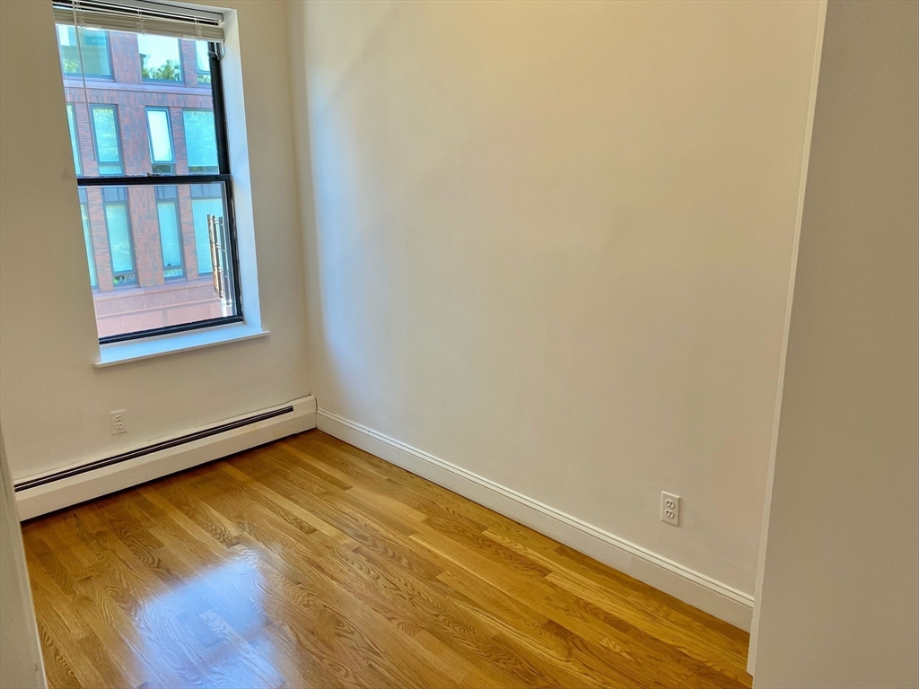 225-227 East Berkeley Street, Unit 4 Boston, MA 02118 - Photo 6 of 10 a view of a room with wooden floor and a window