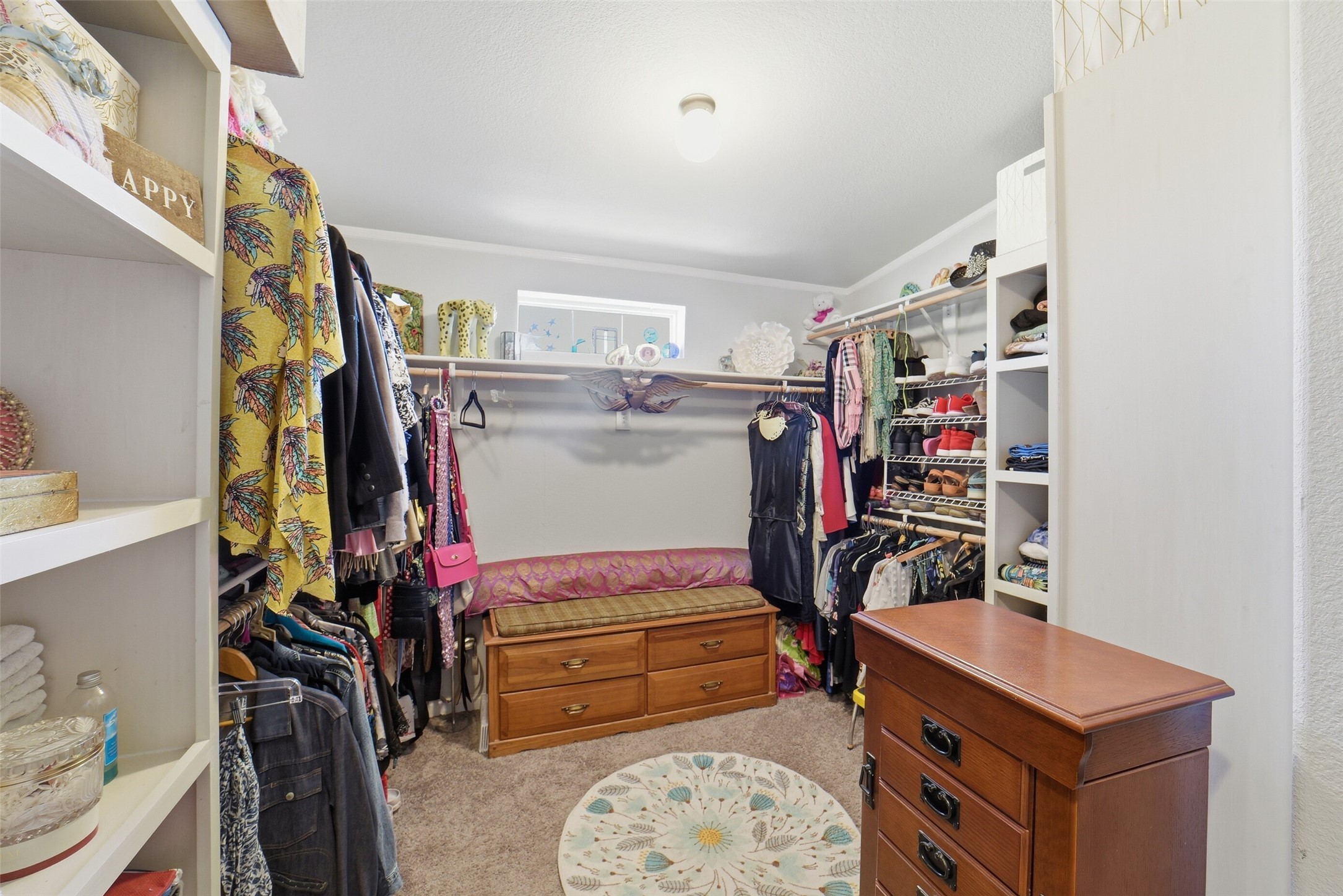 4007 Nancy Lane, Unit C546B Rosharon, TX 77583 - Photo 36 of 50 a view of walk in closet with clothes and shoes