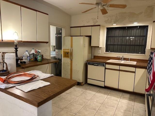 8932 Ridgeland Drive Cutler Bay, FL 33157 - Photo 11 of 12 a kitchen with stainless steel appliances a stove a refrigerator a sink a counter top space and cabinets
