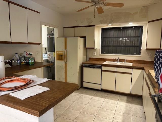 8932 Ridgeland Drive Cutler Bay, FL 33157 - Photo 4 of 12 a kitchen with stainless steel appliances a refrigerator sink and cabinets