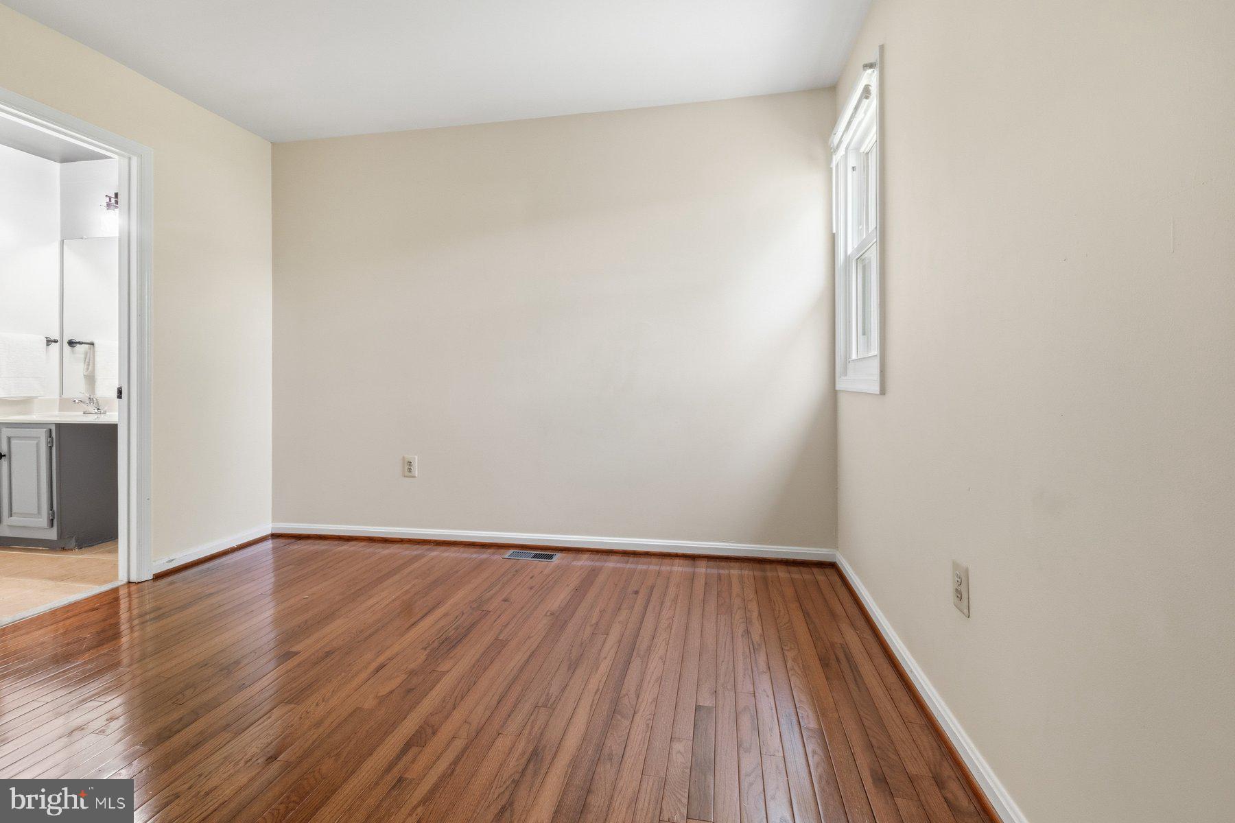 14215 Greenview Drive Laurel, MD 20708 - Photo 26 of 35 a view of a room with wooden floor