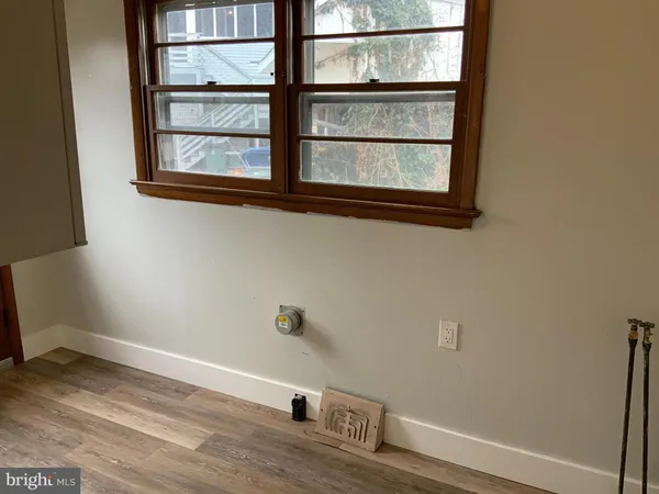 a view of empty room with windows