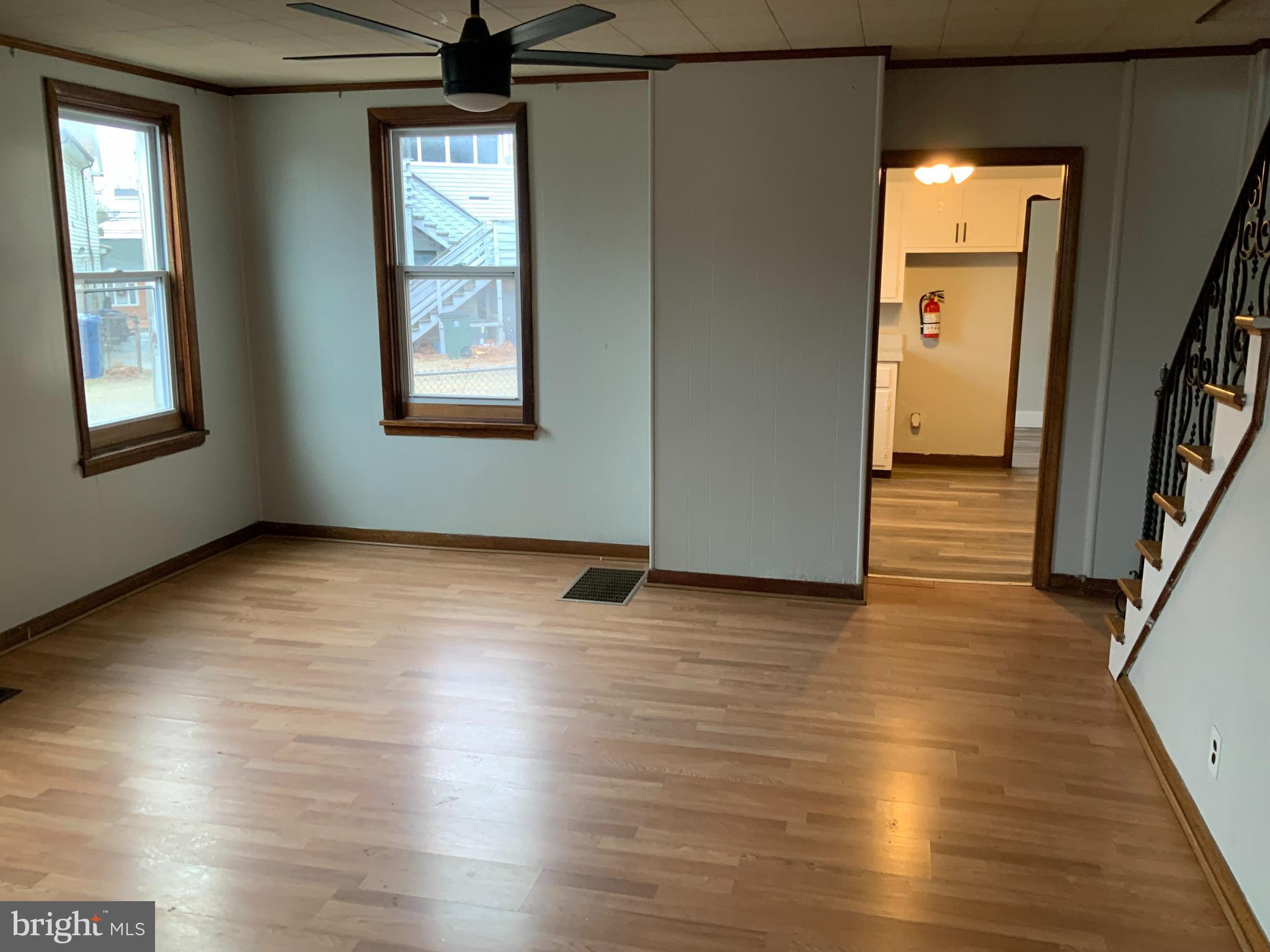 334 Blue Bell Road Williamstown, NJ 08094 - Photo 4 of 18 an empty room with wooden floor and windows