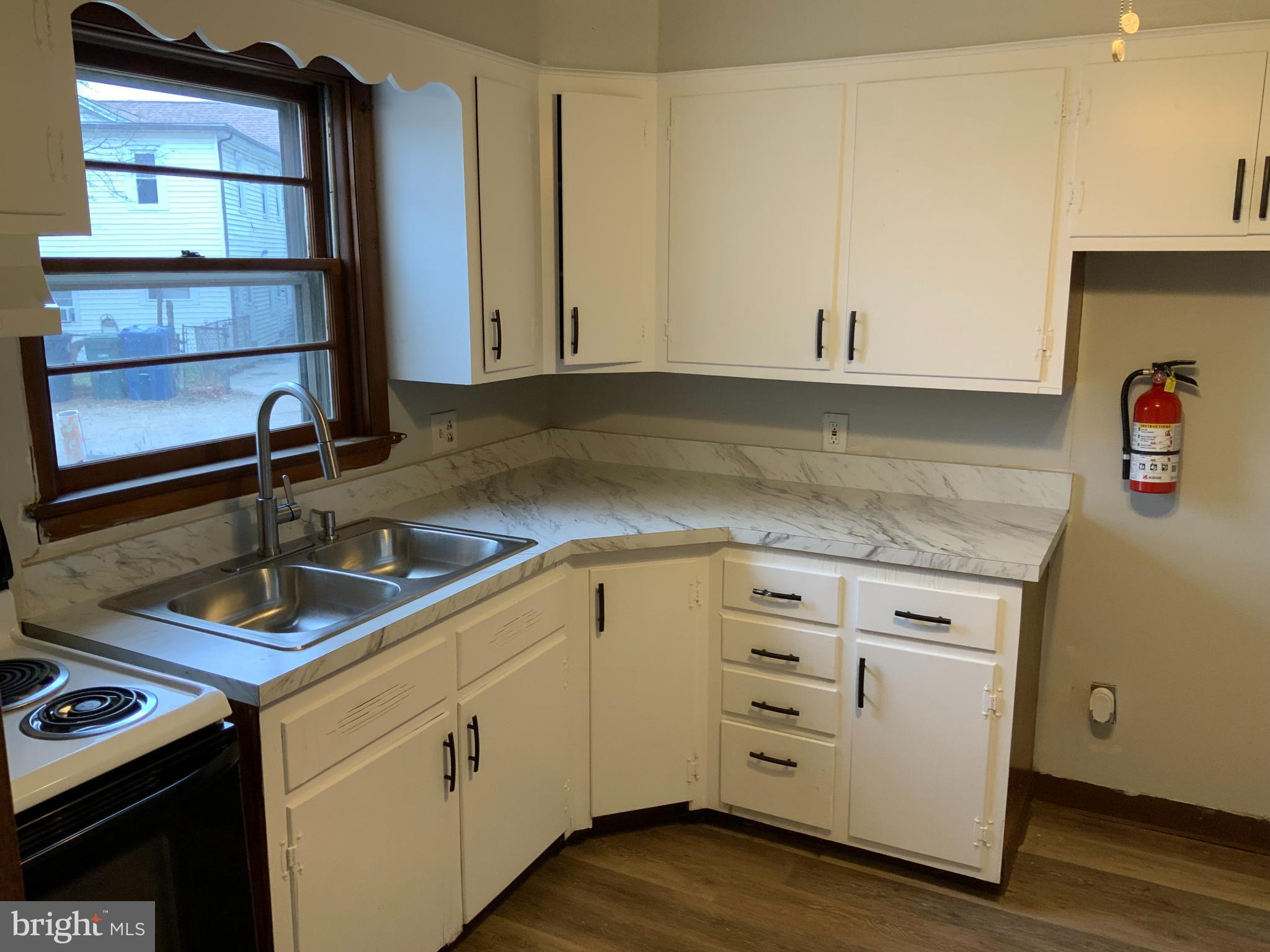 334 Blue Bell Road Williamstown, NJ 08094 - Photo 8 of 18 a kitchen with granite countertop a sink cabinets and appliances