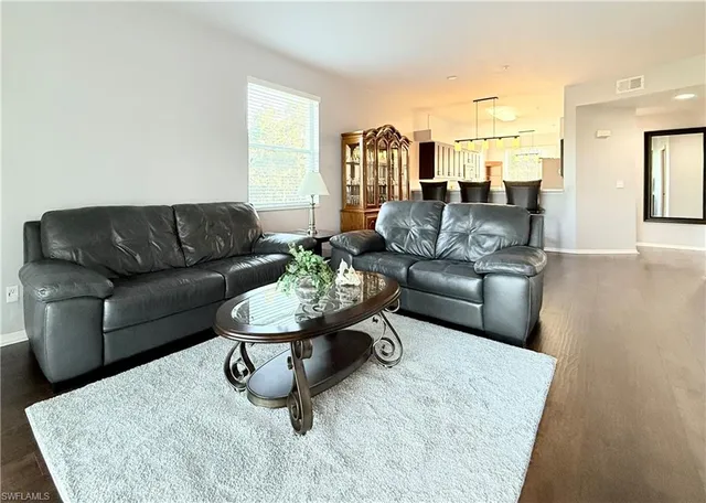 a living room with furniture and a couch