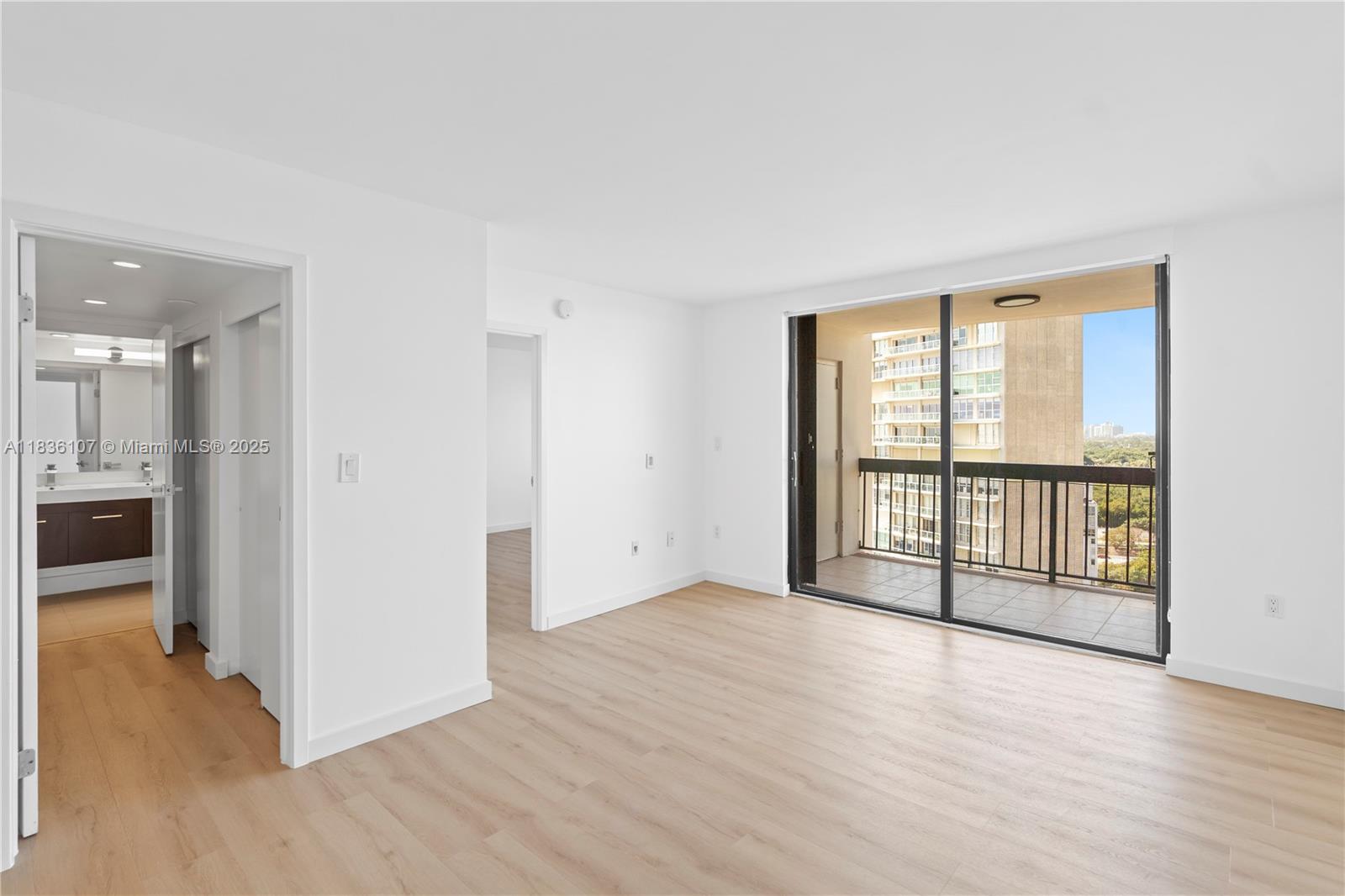 2333 Brickell Avenue, Unit 1908 Miami, FL 33129 - Photo 11 of 29 wooden floor in an empty room with a window