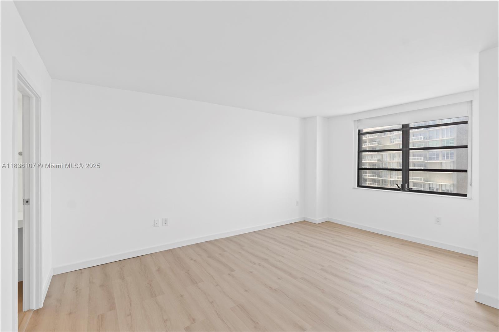 2333 Brickell Avenue, Unit 1908 Miami, FL 33129 - Photo 17 of 29 an empty room with a empty space and window