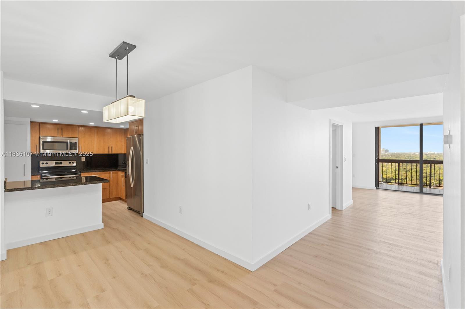 2333 Brickell Avenue, Unit 1908 Miami, FL 33129 - Photo 2 of 29 a view of a kitchen and an empty room