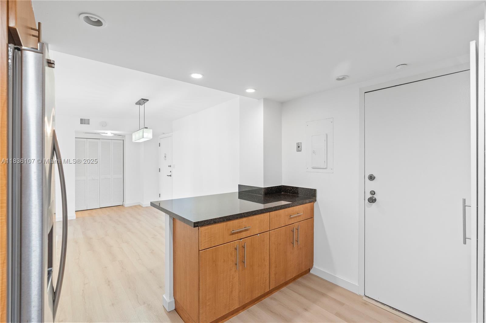 2333 Brickell Avenue, Unit 1908 Miami, FL 33129 - Photo 7 of 29 a kitchen with a sink and refrigerator