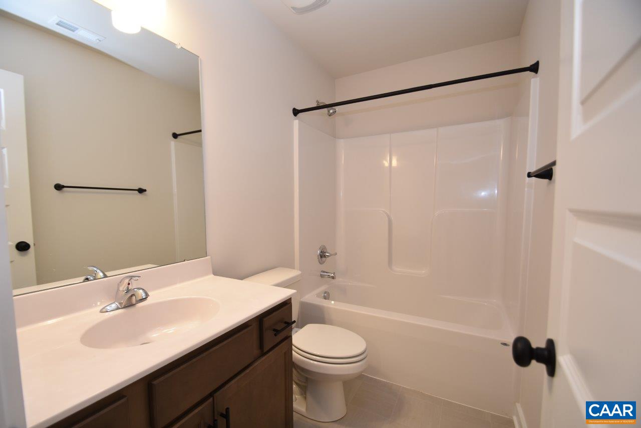 0 Lake Road, Unit HL12A Troy, VA 22974 - Photo 17 of 36 a bathroom with a sink toilet and shower