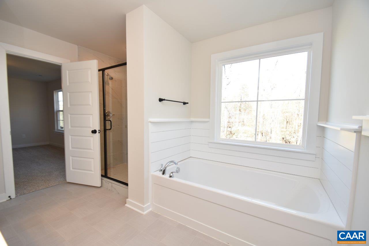 0 Lake Road, Unit HL12A Troy, VA 22974 - Photo 25 of 36 a white bath tub sitting next to a window