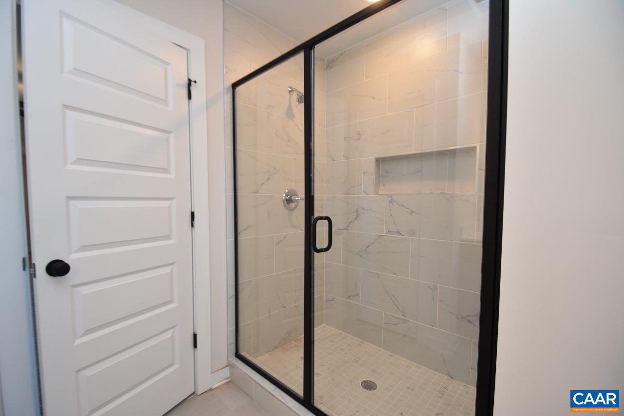 0 Lake Road, Unit HL12A Troy, VA 22974 - Photo 26 of 36 a bathroom with a glass shower door