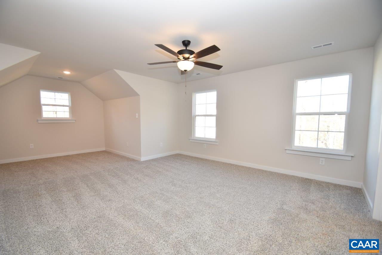 0 Lake Road, Unit HL12A Troy, VA 22974 - Photo 29 of 36 an empty room with windows and fan chandelier fan