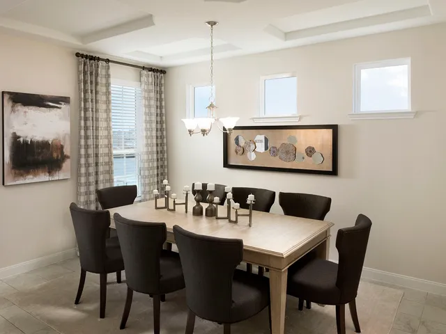 a view of a dining room with furniture and window