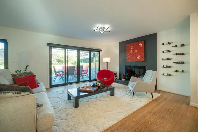 a living room with furniture and a floor to ceiling window
