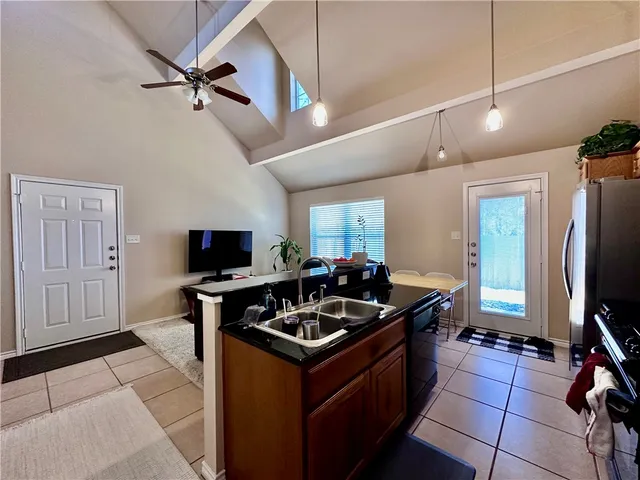 a kitchen with a counter appliances cabinets and a counter top space