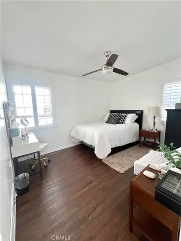 a bedroom with furniture and a window