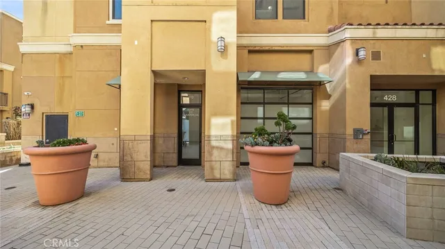 a view of a living room and patio area