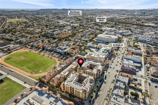 an aerial view of residential houses with outdoor space