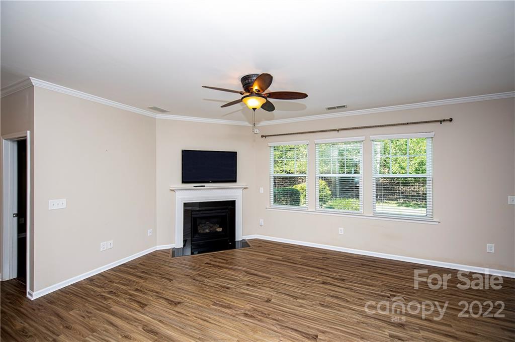 249 Catoctin Road Rock Hill, SC 29732 - Photo 11 of 30 a view of an empty room with a window and wooden floor