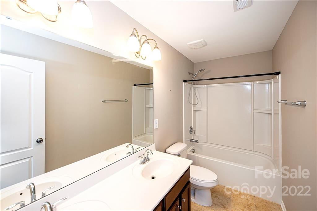249 Catoctin Road Rock Hill, SC 29732 - Photo 19 of 30 a bathroom with a sink a toilet and shower