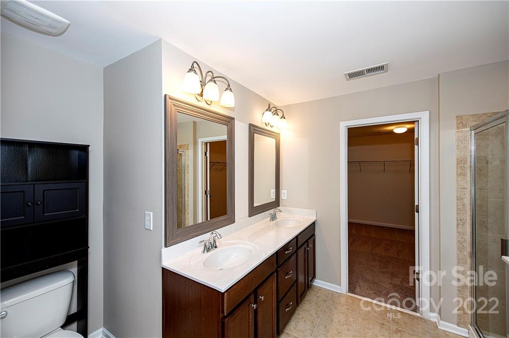 249 Catoctin Road Rock Hill, SC 29732 - Photo 23 of 30 a bathroom with a sink a mirror and a shower