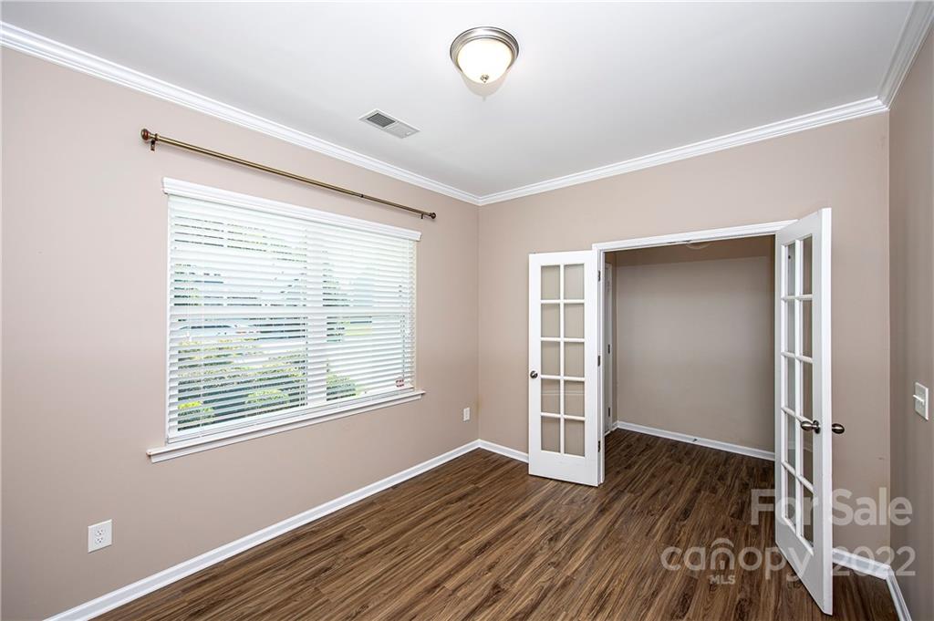 249 Catoctin Road Rock Hill, SC 29732 - Photo 9 of 30 a view of an empty room with wooden floor and a window
