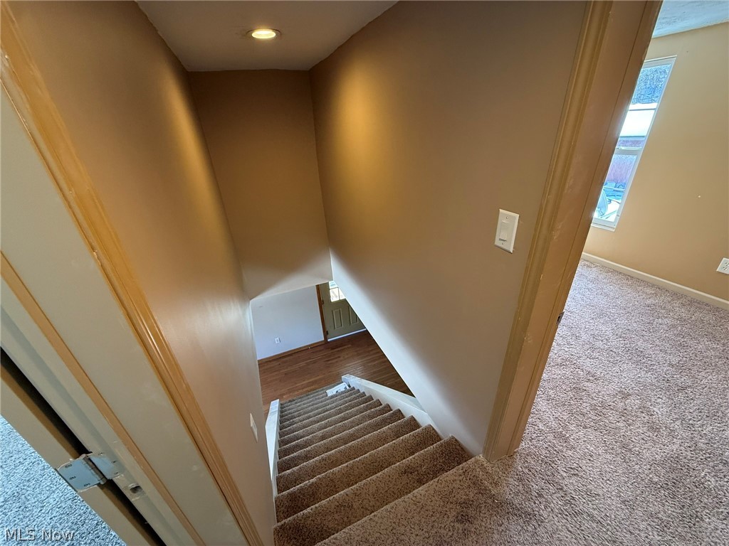 6784 Old Zoarville Road Northeast Dover, OH 44622 - Photo 30 of 50 Staircase featuring carpet and baseboards