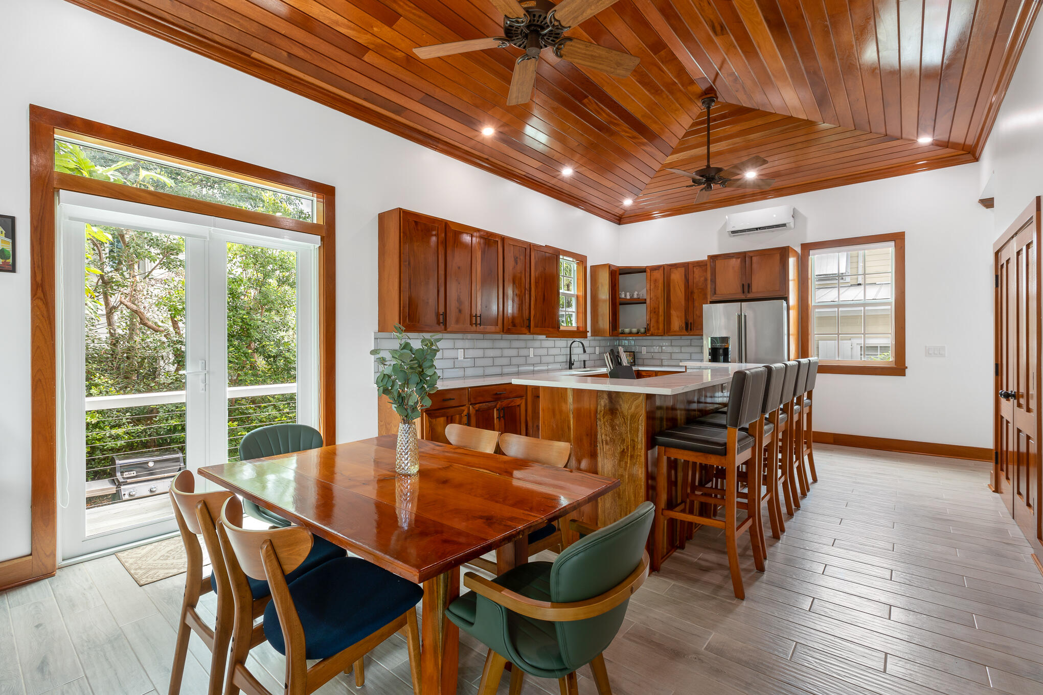 2214 Seidenberg Avenue Key West, FL 33040 - Photo 14 of 37 a view of a dining room with furniture window and wooden floor