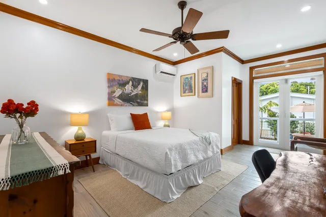 a bedroom with a bed and a couch